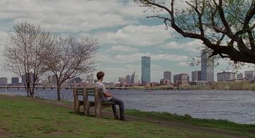 Good Will Hunting_Will sits on a bench by the river