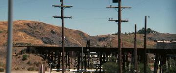 Dirty Harry_Callahan stands on the bridge