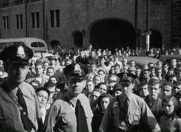 I Confess_Crowds gather outside the courthouse