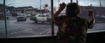 The Goonies_Chunk watches the car chase from the bowling alley